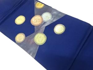 丸紋に草花・家屋模様織り出し　名古屋帯